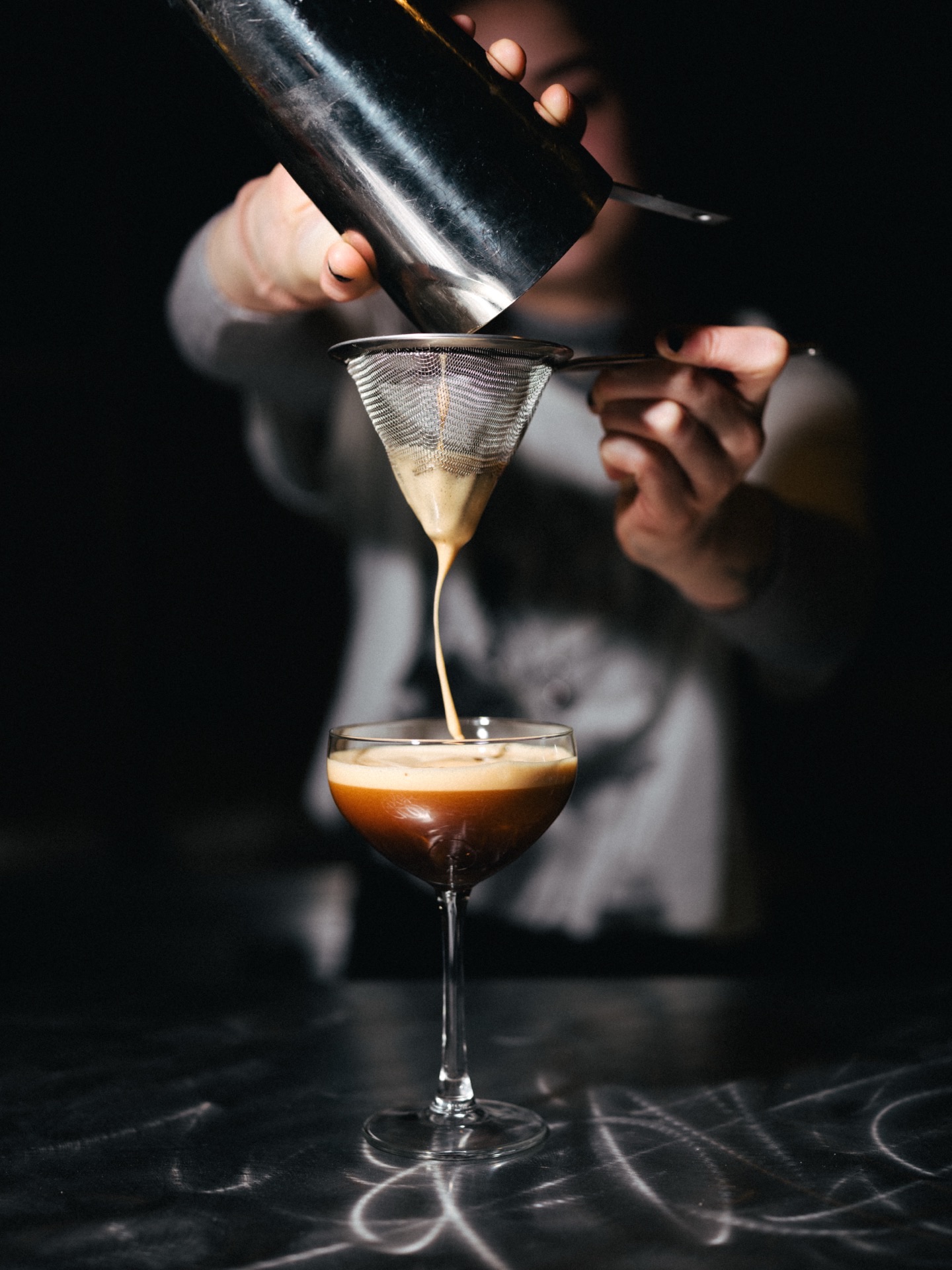 Bartender crafting cocktails